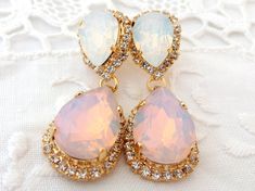 "Pink and white opal Chandelier earrings, Bridal earrings, Bridesmaids gift, Dangle earrings, Drop earrings, Weddings jewelry, Swarovski earrings, Powdered pink, Blush pink, Beauty with Statement. These stunning earrings have a great statement look that can't be missed. They would be great bridal earrings or with an evening dress. Wonderful bridesmaids' gift They are made of 14k gold plated brass posts, Swarovski crystals, all set in prong setting. Made with CRYSTALLIZED™ - high qulity genuine S Elegant White Pink Opal Jewelry, Jeweled Dangle Earrings For Wedding, Silver Opal Earrings For Wedding, Rose Gold Pink Opal Jewelry For Wedding, Wedding Dangle Earrings With Jewels, Gold Pink Opal Jewelry For Wedding, Opal Jewelry With Matching Earrings For Wedding, Wedding Gold Jewelry With Pink Opal, Opal Drop Earrings For Wedding