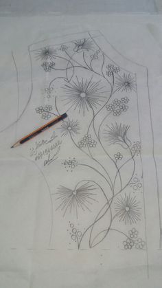 a drawing on paper with a pencil next to it and an image of flowers in the background