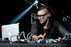 a man sitting in front of a laptop computer