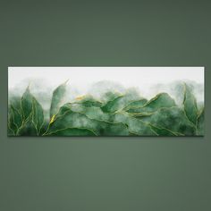 a painting with green leaves on it