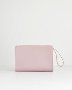 This wristlet pouch from our Meadow Creatures collection is expertly crafted in a feminine shade of Lilac. Adding a pop of pastel colour to any summer outfit, it’s a perfectly practical sized bag for all your everyday essentials. The chic, wrist handle allows you hands free freedom, whilst Fable’s signature bee in gold-tone hardware adds a contemporary luxe finish.
  Key features:
  Approx. 19 (L) x 13 (H) x 6 (D) cm
 Outer: 100% Polyurethane; Lining: 100% Polyester
 Wipe clean with damp cloth Pink Mobile Phone Evening Pouch Bag, Pink Mobile Phone Pouch, Pink Rectangular Feminine Clutch, Pink Rectangular Feminine Wallet, Pink Feminine Rectangular Wallet, Pink Mobile Phone Pouch Clutch, Pink Pouch Clutch For Mobile Phone, Summer Rectangular Wristlet For Everyday Use, Pink Clutch With Removable Pouch For Everyday