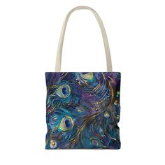 a tote bag with an image of peacock feathers on it