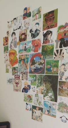 a bunch of pictures are hanging on the wall