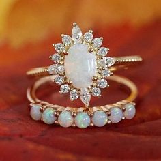 1.1CT Opal Engagement Ring Set 14K Yellow Gold Opal Wedding Ring Set Oval Cut Opal Engagement Ring Oval Wedding Ring, Gift, Anniversary Ring ❋ RING DETAIL ❋ Metal: 925 Sterling Silver (Can be made in Yellow gold & rose gold plated as well) Gemstone -: Opal  Stone Shape-: Oval  Stone Size - : 6x8 mm  Side Stone Size -: 1.50 mm Round + 1.50x3 marquise  ✥Features✥ ✥ Ready to Ship in 5-7  Business Days ✥ I accept custom making order.Please contact me if you need this service. ✥ Please Feel Free to contact us 24*7 to discuss for any order ✥ For all the jewelries,there is a 30 days money back guarantee. ✥ All items will be well packed in a beautiful ring box. ✥ If you want to upgrade your shipping speed then please add this with your product PLEASE BE ADVISED BEFORE PURCHASING: *We can not be he Luxury Yellow Gold Opal Ring With Halo Design, Classic Oval Cabochon Diamond Wedding Ring, Oval Wedding Ring With Prong Setting, Oval Wedding Rings With Diamond Accents, Heirloom Oval Diamond Wedding Ring, Oval Prong Setting Bridal Sets As Gift, Oval Bridal Sets With Prong Setting As Gift, Stackable Oval Rings For Anniversary, Oval Bridal Sets With Center Stone For Anniversaries