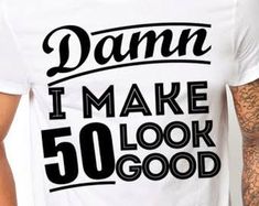 a man wearing a white shirt that says damn i make 40 look good