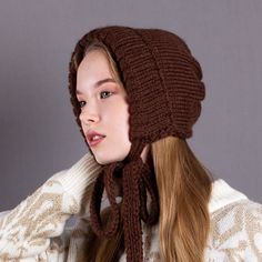 This season, a women's elegant adult bonnet is sure to become an essential accessory for your wardrobe. Warm, soft, and cozy thanks to the premium yarn, it will keep you comfortable in cold weather. With a rich palette of colors to match any outfit, this bonnet will help you look super trendy and turn heads. Suitable for both girls and women. It is suitable for the winter, as it is knitted in two strands of yarn, or for the unpredictable spring and autumn seasons. Feel fashionable and elegant in Casual Warm Bonnet, Affordable, Warm Fall Bonnet, Cozy Adjustable Winter Bonnet, Knitted Winter Bonnet Cap, Warm Bonnet With Ear Flaps For Cold Weather, Cozy Warm Solid Color Bonnet, Warm Bonnet Cap For Fall, Winter Bonnet With Ear Flaps, One Size Fits Most, Beige Bonnet For Fall, One Size Fits Most