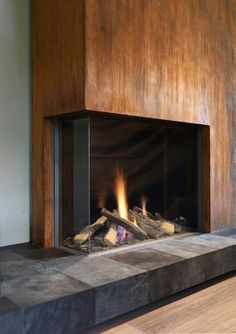 a fireplace with wood burning in it