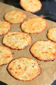 baked crackers sitting on top of a piece of wax paper