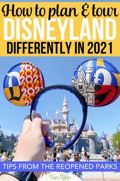 someone is holding up mickey mouse ears in front of the castle with text overlay that reads how to plan & tour disneyland in 2021