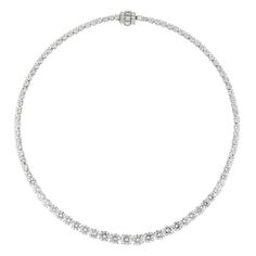 An Important diamond riviere necklace, the eighty-nine round brilliant-cut diamonds graduating from the centre, weighing approximately a total of 30.5 carats, the five larger diamonds, weighing 0.96, 1.16, 1.41, 1.15, and 0.99 carats, accompanied by GIA Reports stating to be of D-E colour, VVS2-VS1 clarity, all claw-set in white gold collets with safety box clasp encrusted with five baguette and six small brilliant-cut diamonds, mounted in white gold, circa 1990, later hallmarked 18ct gold London, bearing the Bentley & Skinner sponsor-mark, measuring approximately 43 x 0.7cm, gross weight 42.5 grams. This necklace is in perfect condition. This is a glamorous and arresting necklace. From the collection of Bentley & Skinner, the London jewellers by appointment to both Her Majesty the Queen a Fifth Avenue Collection Jewellery Canada, Lyme Park, Riviere Necklace, White Diamond Jewelry, Safety Box, The Bling Ring, Diamond Necklace Designs, Luxury Necklace, Circle Diamond