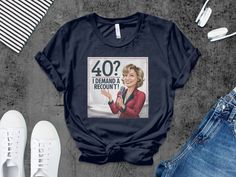 a t - shirt with the image of a woman holding a microphone in her hand