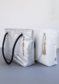 "White Zipper Shoulder Bag, Eco Friendly Gift For Her, Vegan Bag, Minimal Tote Bag, Light Shoulder Bag, Minimalist Bag, White Beach Bag Zippered bag, lightweight, roomy and very comfortable, it made out of white or silver Tyvek®. Inside the zip pocket. The straps of the bag is a cotton cord. Pendant with woos and tassel attached to each bag. The bag is very practical, you can wash or smudge the fine dirt with a damp cloth. Although white does not get dirty like regular white materials. The bag m White Beach Bag, Tyvek Bags, Linen Bags, Summer Purse, Noren Curtains, Vegan Tote Bag, Bag Inspiration, Bag Minimalist, Vegan Bag