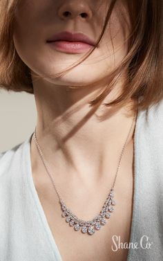 Each anniversary deserves a little sparkle. Give an anniversary gift that sparkles just a little more. This stunning teardrop diamond necklace showcases 201 brilliant round diamonds. Crafted in quality 14k white gold, this necklace hangs from an adjustable 18″ cable chain and the diamond portion measures 3 1/2″ across. Article number: 41084397 Simple Diamond Jewelry, Teardrop Diamond Necklace, M Necklace, Teardrop Diamond, Bridal Accessory, Jewelry Cleaning Solution, Simple Diamonds