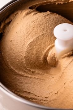 a close up of a food processor filled with something brown and ready to be mixed