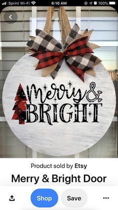 a merry and bright sign hanging from the side of a door with a bow on it