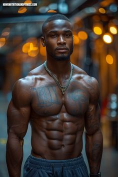 a shirtless man with tattoos on his chest