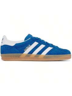 adidas Originals 
Blue Gazelle Indoor Sneakers 
Low-top suede and buffed leather sneakers in blue. 
. Lace-up closure 
. Logo embossed at tongue 
. Paddedllar 
. Text stamp at outer side 
. Signature serrated stripes at sides 
. Logo ped at heel tab 
. Buffed leather lining 
. Treaded rubber sole 
Supplierlor: Blue bird/Cloud white/Gum 
Upper: leather. Sole: rubber. 
Made in Indonesia. 
242751M237017 
Originals | Blue Gazelle Indoor Sneakers default         Sports & Outdoor Shoes, size features Blue Gazelle, Casual Athletic Shoes, Casual Athletic, Cloud White, Outdoor Shoes, Blue Lace, Blue Bird, Leather Sneakers, Low Top