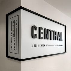 the central sign on the wall is black and white