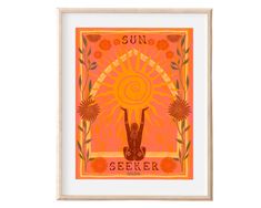 a framed poster with the words sun seeker in front of an orange and yellow background