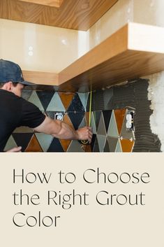 a man working on a tile backsplash with the words how to choose the right grout color