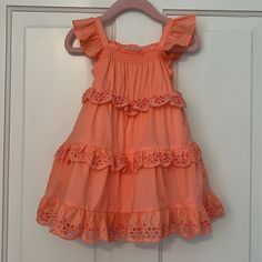 New With Tags! Janie And Jack Baby Girl Eyelet Ruffle Dress. Color Is Peach Amber (Such A Pretty Color). Size 18-24 Months. No Rips, Stains Or Odors. Retail Price: $79. Description From Janie And Jack’s Website: “Warmer Days Are Calling In This Breezy Dress. With A Stretch Smocked Neckline, Ruffle Straps And Tiered Eyelet Details We Love. 100% Cotton Batiste Fully Lined Sleeveless; Button Back Above The Knee Length Bloomer Included (Sizes Up To 18-24m) Machine Washable; Imported” Please See All Cute Ruffled Dresses For Dress-up, Playful Tiered Dress With Ruffle Hem, Spring Dresses With Ruffles For Playdate, Spring Ruffle Dress For Playdate, Playful Tiered Ruffle Dress, Cute Tiered Ruffle Sundress, Cute Tiered Ruffled Sundress, Spring Twirl Dress With Ruffle Hem For Playdate, Playful Ruffle Sleeve Dresses For Playtime