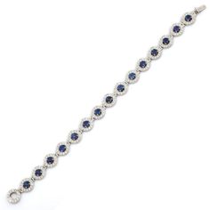 Blue Sapphire and Diamond bracelet in 18K Gold. It has a perfect round cut gemstone to make you stand out on any occasion or an event. A tennis bracelet is an essential piece of jewelry when it comes to your wedding day. The sleek and elegant style complements the attire beautifully, whether it's the bride wearing it herself, or as a gift to her bridesmaids to wear on the D’day.  Bracelets are worn to enhance the look. Women love to look good. It is common to see a woman rocking a lovely gold bracelet on her wrist. A gold gemstone bracelet is the ultimate statement piece for every stylish woman.  PRODUCT DETAILS :-  > Material - 18K Solid White Gold > Gemstone - Blue Sapphire  > Stone Weight - 6.5 ct > Stone Shape - Round  > Stone Pcs - 15 > Stone Size - 4 mm > Diamond Weight - 4.8 ct  > D Bracelet For Her, Designer Bracelet, White Gold Sapphire, Sapphire Wedding, Sapphire Color, Wedding Jewelry Bracelets, Sapphire Bracelet, Exclusive Jewelry, Tennis Bracelet Diamond