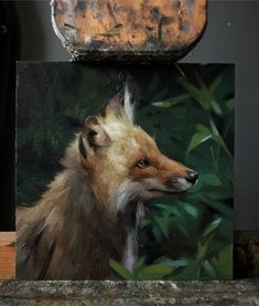 a painting of a fox on a wooden block with green foliage in the background and a rusted metal object above it