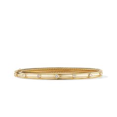 This bracelet is made of 18K yellow gold and features diamonds as its primary gemstone. It belongs to the Renaissance collection. David Yurman Stacked Bracelets, Yurman Stacked Bracelets, Stacked Bracelets, Bracelet Stacks, Jewelry Education, Cable Bracelets, Classical Design, Modern Watches, Diamond Guide