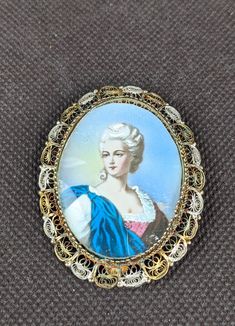 Vtg Italy 800 Silver Filigree Gold Portrait Lady Woman Oval Pin Brooch Can also be worn as a pendant. Vintage Filigree Pendant Brooch, Vintage Filigree Pendant Brooches, Vintage Oval Brooches For Wedding, Vintage Oval Wedding Brooches, Vintage Oval Brooches For Collectors, Ornate Oval Filigree Brooches, Gold Portrait, Silver Filigree, Pin Brooch