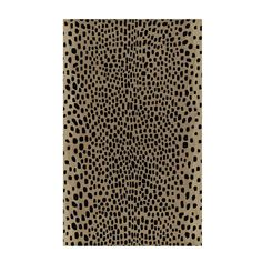 an animal print rug with black spots on it