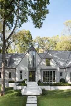 a white house with steps leading to the front door