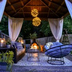 an outdoor living area with furniture and lights