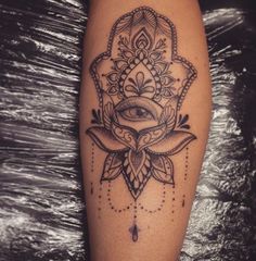 a woman's leg with a tattoo on it