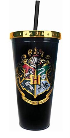 a harry potter tumbler with a straw sticking out of it's lid and the hogwarts crest