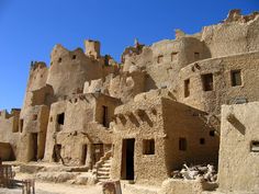 an old adobe building in the desert