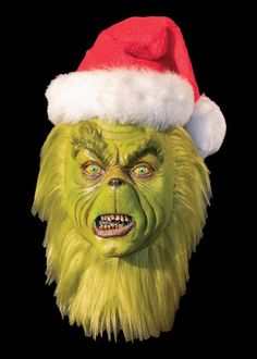 * * * A Halloween-Mask.com  Exclusive * * * Meet the Mean One  - our tribute to the loved and loathed Christmas-time grouch portrayed by Jim Carrey in the movie The Grinch.  Our Grinch has all of the characteristics - green skin complexion; bushy eyebrows and lashes; stained yellow brown teeth (sorry, no termites); and green fur-filled countenance.  This bad banana is our King of Sinful Sots! This can be used as a bust/prop/display piece or made into a wearable mask. The Santa Hat is included.  Full overhead latex mask.  Hand painted and made in the U.S.A. Jim Carrey Grinch, Grinch Movie, Der Grinch, The Grinch Movie, Bushy Eyebrows, Amazing Halloween Makeup, Green Fur, Green Skin, Halloween Mask