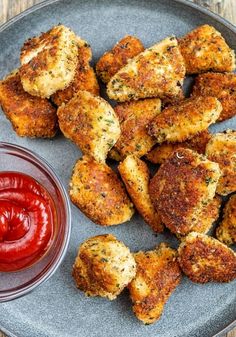 some fried food on a plate with ketchup