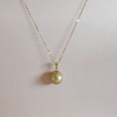 Stunning Golden South Sea Pearl Mounted On A Beautiful 18k Yellow Gold, Filigree Bail. Pearl Color Is Rich Golden,With A Subtle Hint Of Pink Overtone . There Are Two Blemishes On Its Back Side That Are Not Visible When Worn. Pearl Shown In Pictures Is The Exact One You Will Receive. Color Of The Pearl Is Not Enhanced, Dyed Or Edited. Pictures And Video Are Part Of The Description Note: Pearls Are Crafted By Mother Nature Herself. No Two Are Alike. Please Note That There May Be Variation In Color Elegant Gold High Luster Jewelry, Elegant High Luster Gold Jewelry, Elegant Gold Necklace With High Luster, Elegant Gold Necklaces With High Luster, Elegant High Luster Yellow Gold Necklace, Elegant Yellow Beaded Jewelry, Elegant Yellow 14k Gold Jewelry, Elegant Yellow Jewelry With Round Beads, Elegant Yellow Pearl Necklace For Formal Occasions