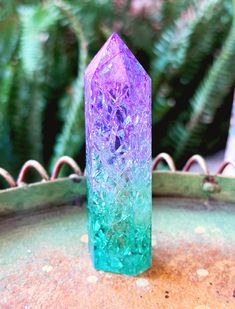 A beautiful Aura Crackle Clear Quartz Tower Purple and Green * Used to amplify other crystals, physical body, energy, thoughts and intentions * Known as the "master healer" because it its ability to be programed to work on any ailment * Helps clear and activate all energy centers of the body * Has the ability to work with any health condition and the body and bring balance * Aids in pain relief * helps stimulate the mind and boost memory * Aids in releasing negative emotional attachments to others * Chakra: Crown * Zodiac Sign: All These are natural crystals and gemstones and no two are alike. Each piece is unique and may vary in shape and coloring. We cannot guarantee perfect points or stones.  Disclaimer: Crystals should not be used as a replacement for medical treatment. The information Beautiful Aura, Purple Aura Quartz, Mystical Natural Purple Crystals, Angle Aura Quartz, Luxury Purple Healing Crystals, Boost Memory, Luxury Purple Spiritual Crystals, Energy Centers, Body Energy