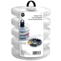 three plastic containers filled with different types of beads and other things in them on a white background