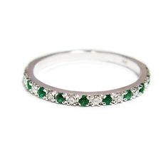 This elegant 14K gold half eternity ring set with a line of alternating green emeralds and sparkling white diamonds, and has a high polished glare.  #jonjonjewel #weddingrings #gemstonerings #emeraldjewelry Green Diamond Half Eternity Ring, Fine Jewelry Green Emerald Half Eternity Ring, Green Emerald Ring With Single Cut Diamonds For Promise, Green Emerald Half Eternity Ring Fine Jewelry, Emerald Green Promise Ring With Single Cut Diamonds, Green Diamond Eternity Band With Prong Setting, Green Emerald Ring With Half Eternity Style, Green Diamond Ring With Half Eternity Band, Green Diamond Half Eternity Round Cut Ring