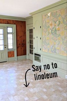 an empty room with wood paneling and tile flooring that says say no to linoleum