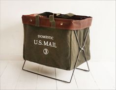 a large bag sitting on top of a folding chair with the words domestic u s mail printed on it