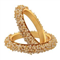 # 1 Pair = 2 Bangles # Sizes: 2.4, 2.6, 2.8 only # Light Weight Gold Plated Bangle Sets.  # Evergreen & classic design, to make an apt match to your Indian Traditional.  # Ideally suitable for all occasions of celebrations.  # Tiny Pearl Studded Golden Bangles.  # Looks like real gold.  Dispatch Time: 1 Day I promise the quality of product and packing. You can send message via Etsy conversation if you have questions before order. Feedback: Your feedback/review will immensely help me to improve my products. Gold Loan, Golden Bangles, Wedding Bangles, The Bangles, Bangles Set, Gold Plated Bangles, Sell Gold, Buying Diamonds, Indian Traditional