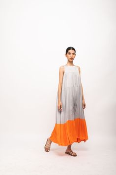 Grey-Orange halter neck maxi dress with gathers throughout and orange gathers at the end of it.Party Wear, Casual, Office Wear, Day Wear, Holiday Wear Fabric : Bemberg Modal Silk Grey-Orange Color Butter Crepe Lining Colorblocked Pattern 7-14 days Delivery Dry clean only Dress With Gathers, Halter Neck Maxi Dress, Holiday Wear, Halterneck Dress, Bamboo Fabric, Sustainable Clothing, Grey Blue, Just The Way, Office Wear