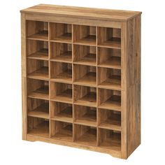 a wooden bookcase with many compartments on the front and bottom shelves in various sizes