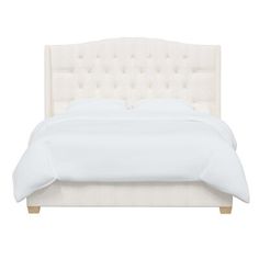 a bed with white linens and buttons on the headboard is shown in front of a white background