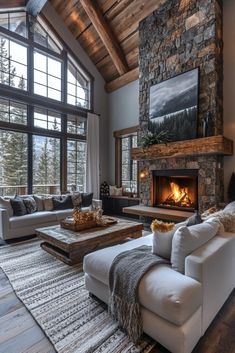 a living room filled with furniture and a fire place in the middle of a room