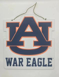 Introducing our Auburn Logo Wooden Door Hanger, perfect for any die-hard Auburn fan! Made of durable and lightweight wood, this white door hanger proudly displays the iconic Auburn logo and "War Eagle" message. Show off your team spirit and support in a unique and eye-catching way. White Door Hanger, Auburn Logo, Bride Birthday, Cooler Gift, Wooden Door Hanger, Sweet Grace, White Door, Sparkle Shoes, Wooden Door Hangers