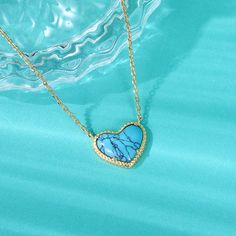 Lending a cool vibe to your look, this necklace makes a fitting choice for everyday wear. We love the textured heart shaped blue stone which gives it a touch of premium appeal while maintaining its elegance. It is suspended from a yellow gold tone sterling silver chain. Whether chosen as a gift or just for you, the details of this necklace were designed to be adored. Pair the heart-cut turquoise necklace with your favorite delicate pieces for a lovable layered look.Carat Weight: 2.1 ctStone Size Blue Heart Pendant Clavicle Chain Jewelry, Turquoise Heart-shaped Necklaces For Gifts, Turquoise Heart-shaped Necklace For Gift, Turquoise Heart Necklaces For Gift, Blue Heart-shaped Clavicle Chain Necklace, Blue Heart Shaped Clavicle Chain Necklace, Blue Heart Clavicle Chain Necklace, Elegant Blue Open Heart Necklace, Blue Open Heart Necklace With Heart Charm